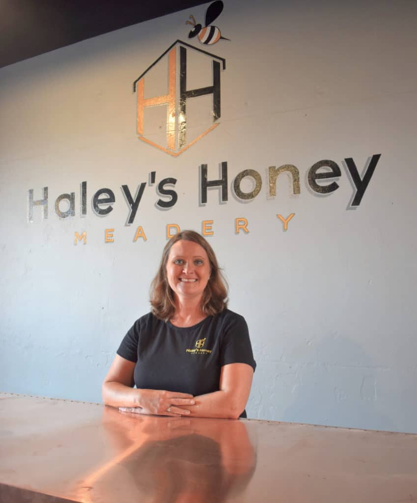 Haley with meadery sign